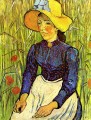 Jeune paysanne dans un chapeau de paille assis devant un champ de blé Vincent van Gogh